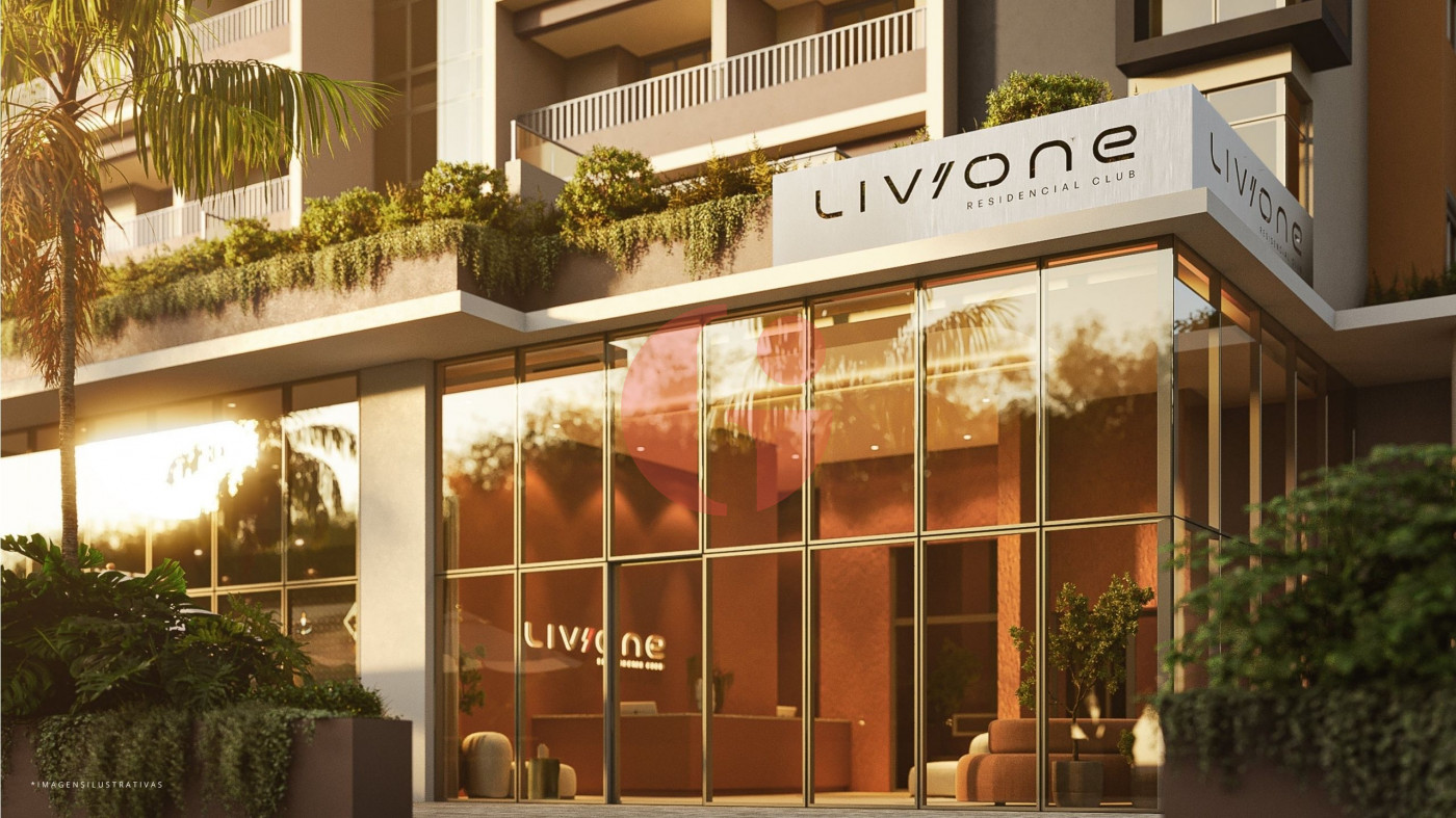 Portaria do LIV ONE com lobby envidraçado, paisagismo e marquise de chegada